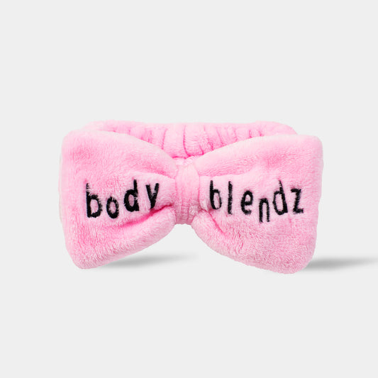 Roosa BodyBlendz peapael lipsukujuga neutraalsel taustal